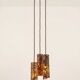 Suspension composed of 3 brutalist copper lamps by Aimo Tukiainen, 1960s.