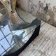 Table basse socle moulé et chrome, années 70