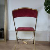 Chaise pliante en métal doré et velours rouge