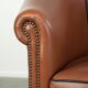 Cowhide club armchair in English style with comfortable seating.