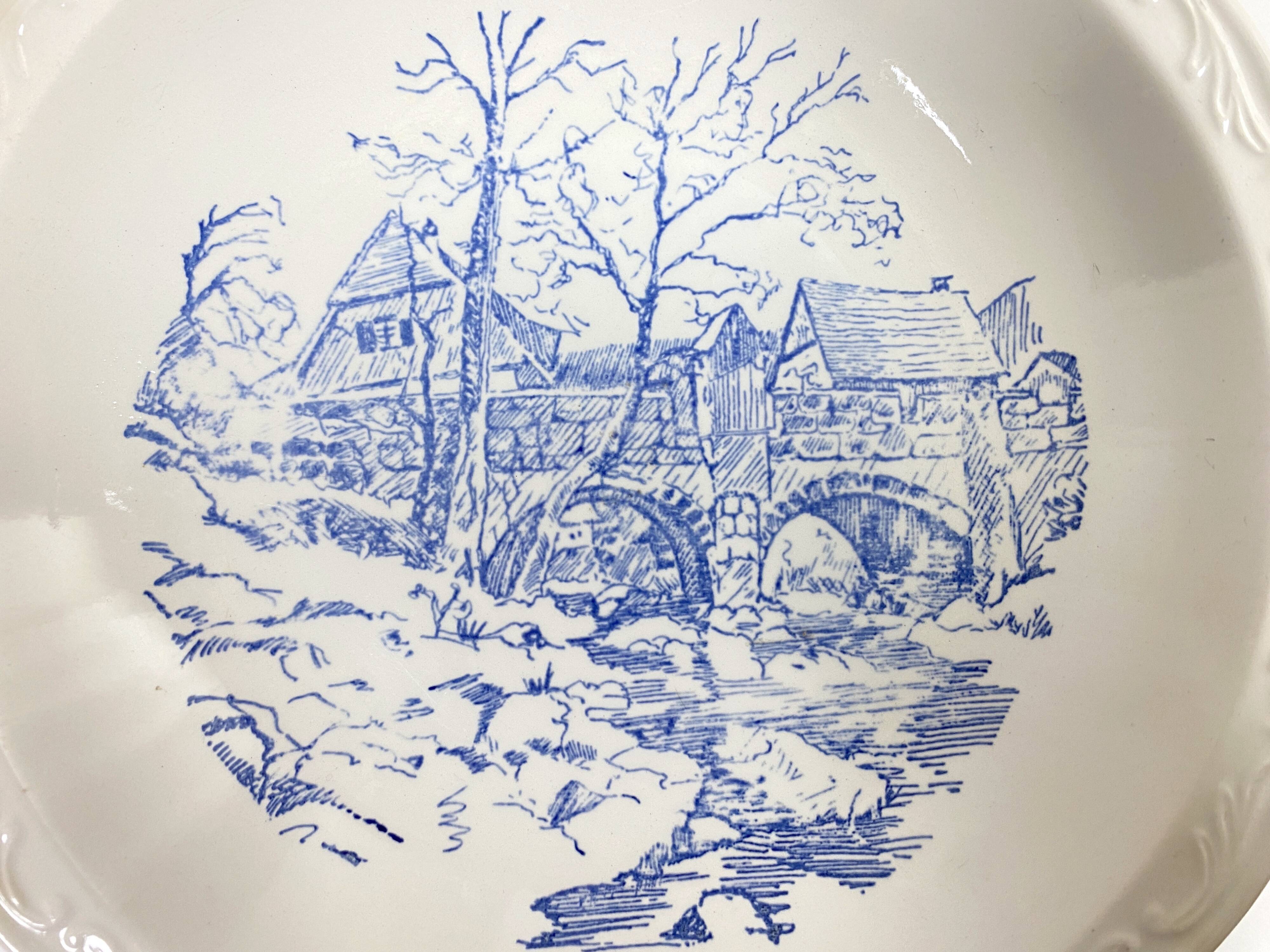 Set of two matching soup plates, one plain and one decorated