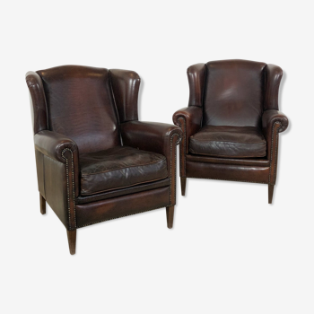 Pair of vintage dark brown sheep leather wingback armchairs