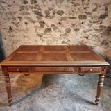 Antique French walnut table with six drawers, parquet top, early 20th century.