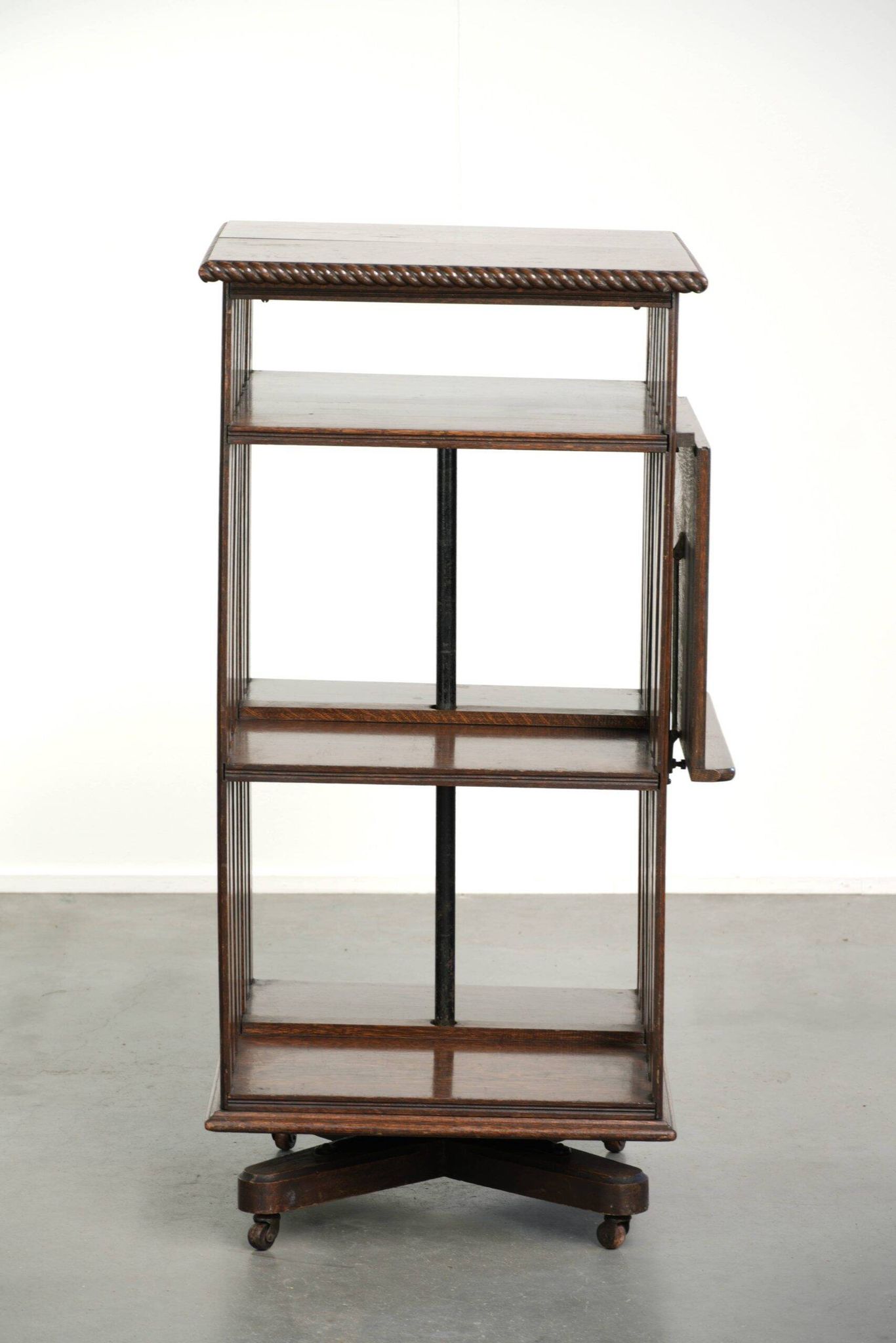 Large antique English oak book carousel from the 19th century