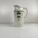 Antique earthenware pitcher, green floral decoration, fine ironstone from the late 19th to early 20th century.