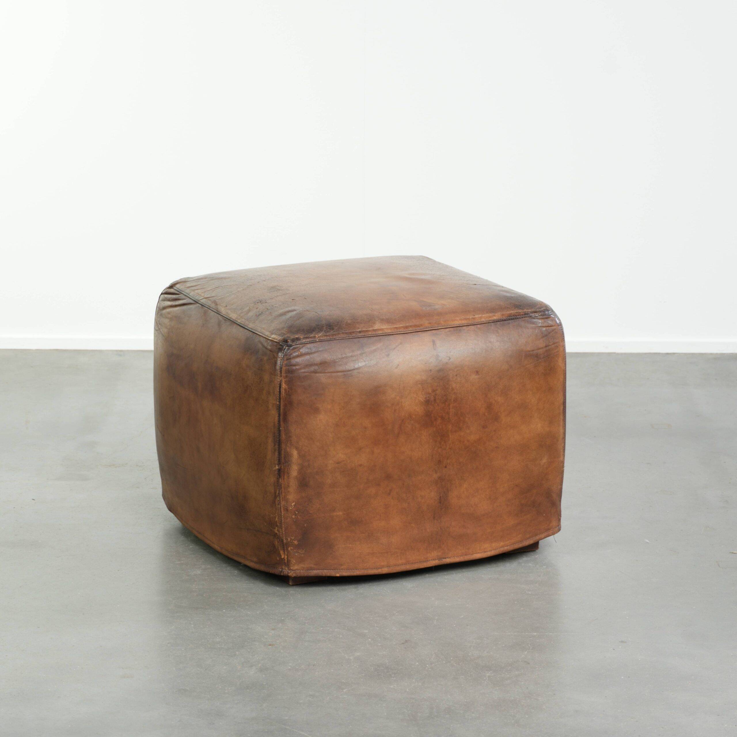 Sheepskin design ottoman with a very beautiful patina and stunning colours