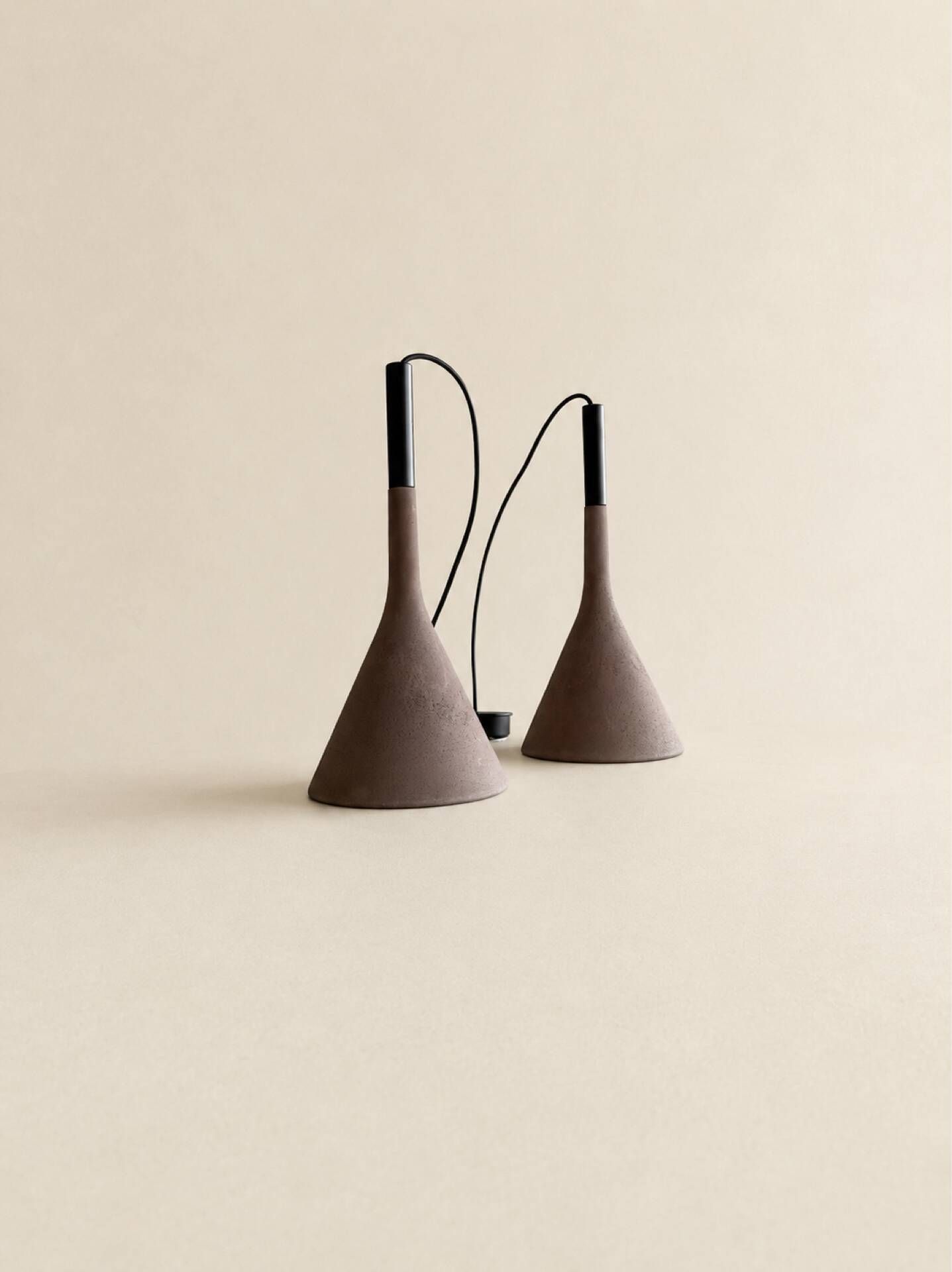 A pair of Aplomb concrete pendants by Lucidi & Pevere for Foscari.