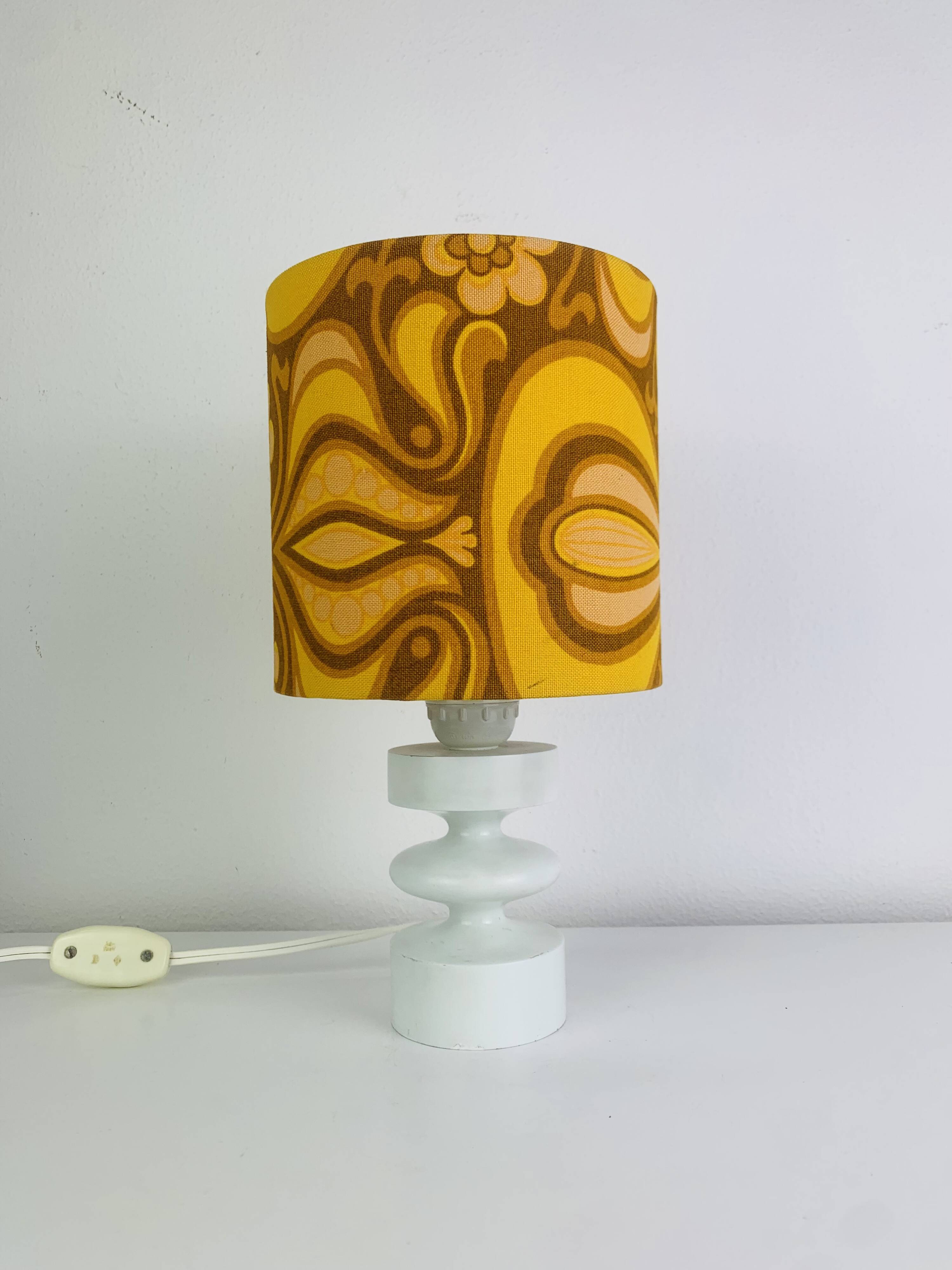 Temde lamp with turned wood and a seventies lampshade.