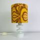 Temde lamp with turned wood and a seventies lampshade.