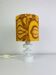 Temde lamp with turned wood and a seventies lampshade.