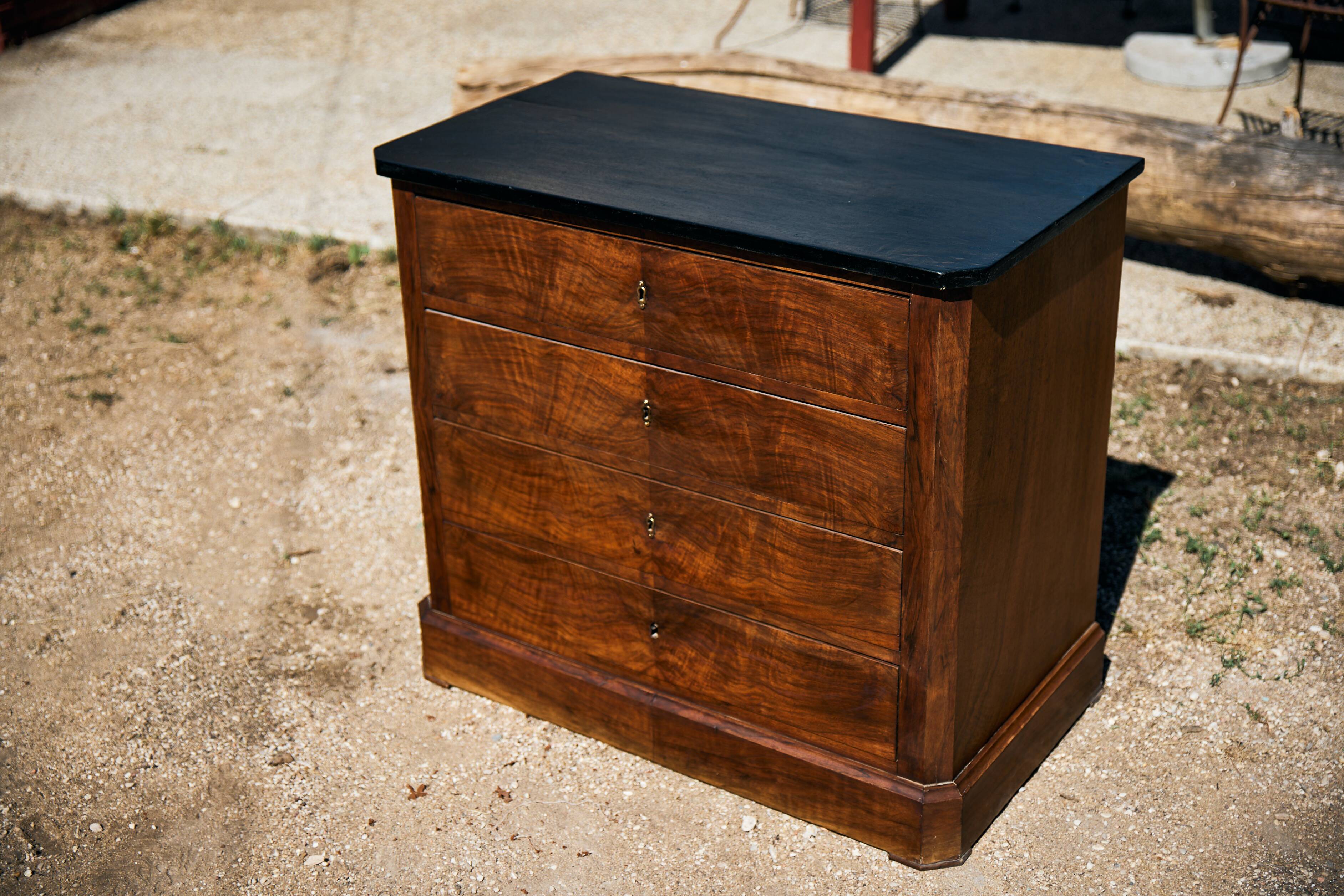 Small Louis-Philippe chest of drawers with four drawers, black top.
