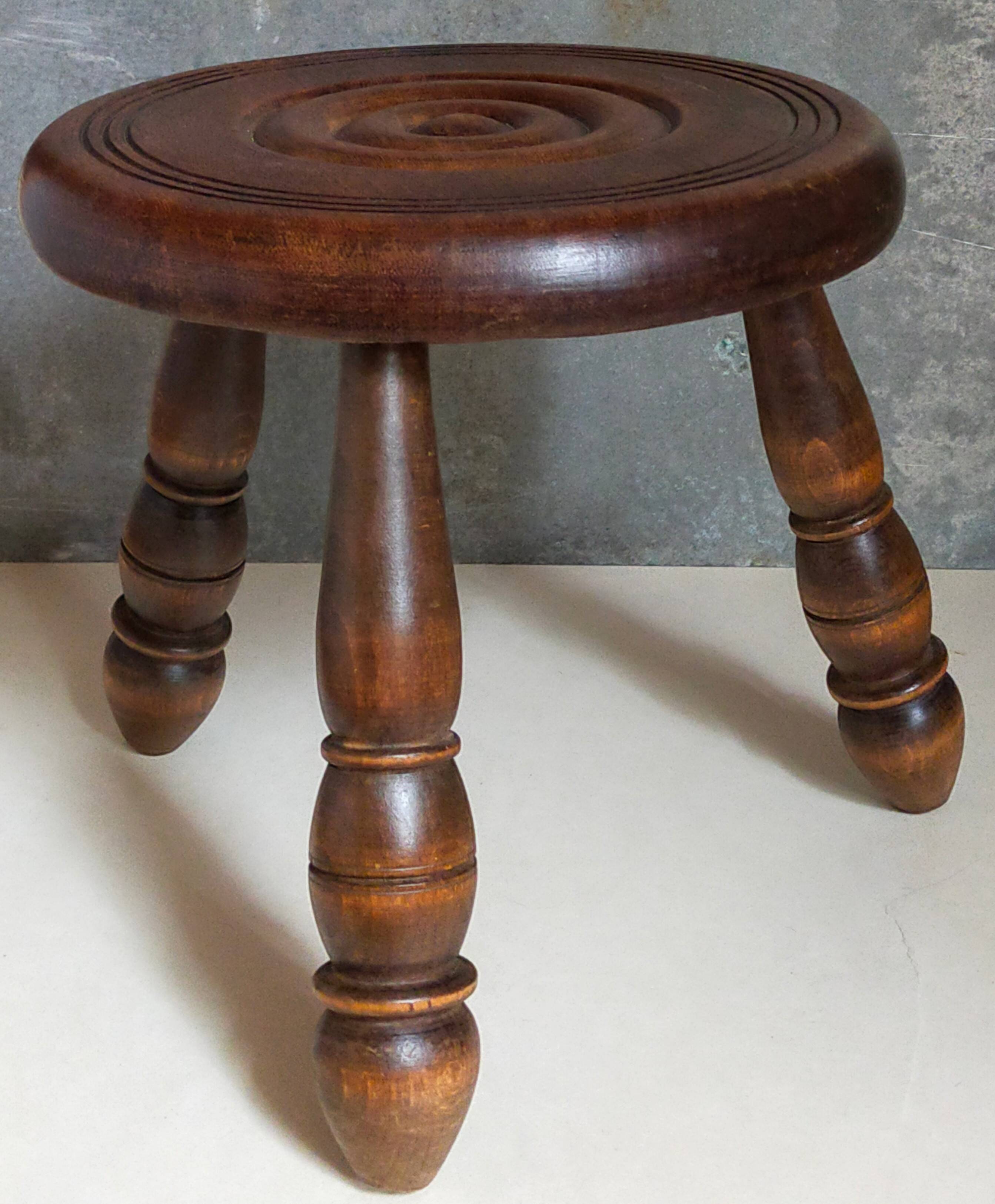 Low tripod stool in vintage turned solid wood