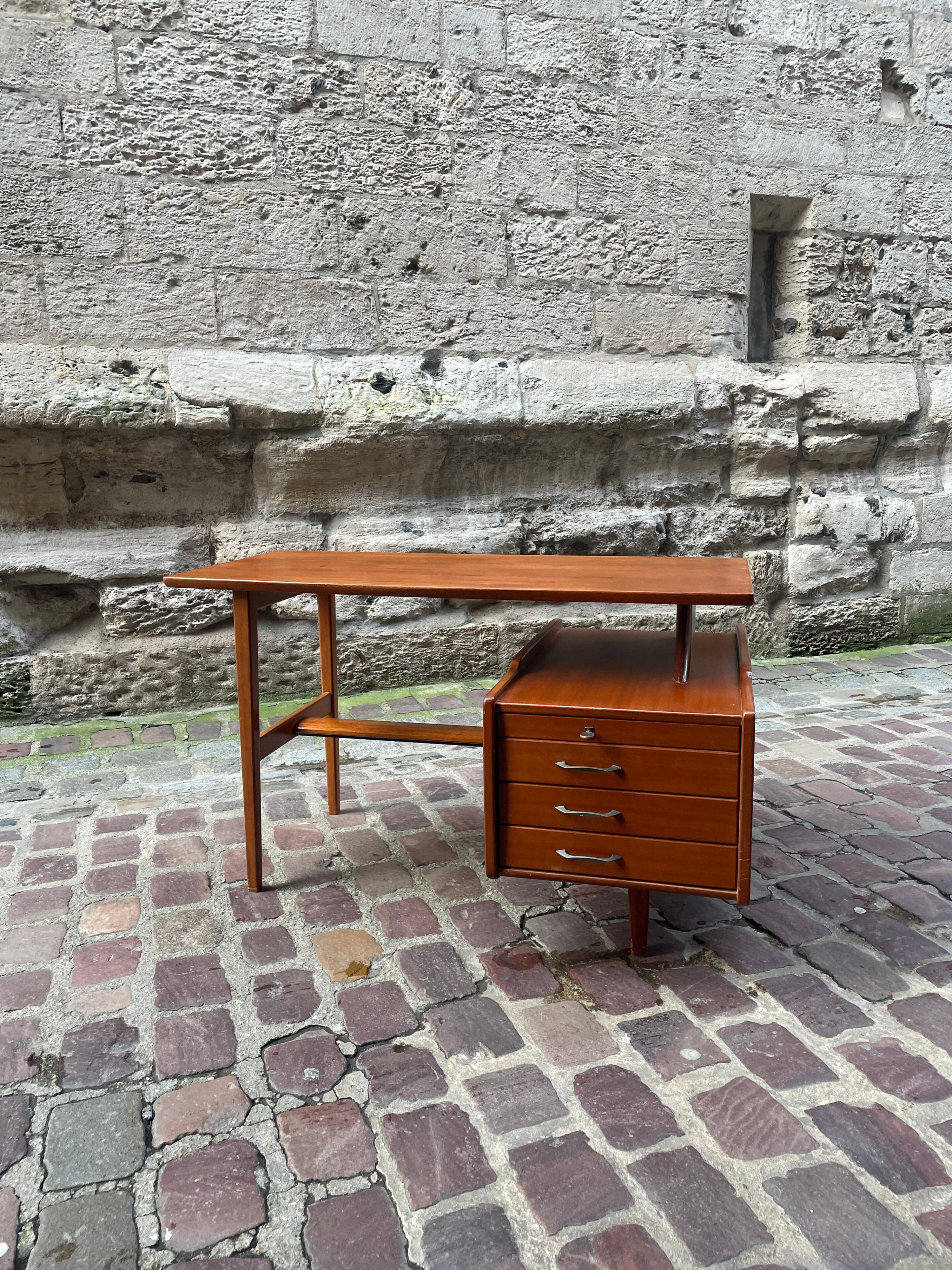 Mahogany desk with drawers by Jacques Hauville published by Bema.