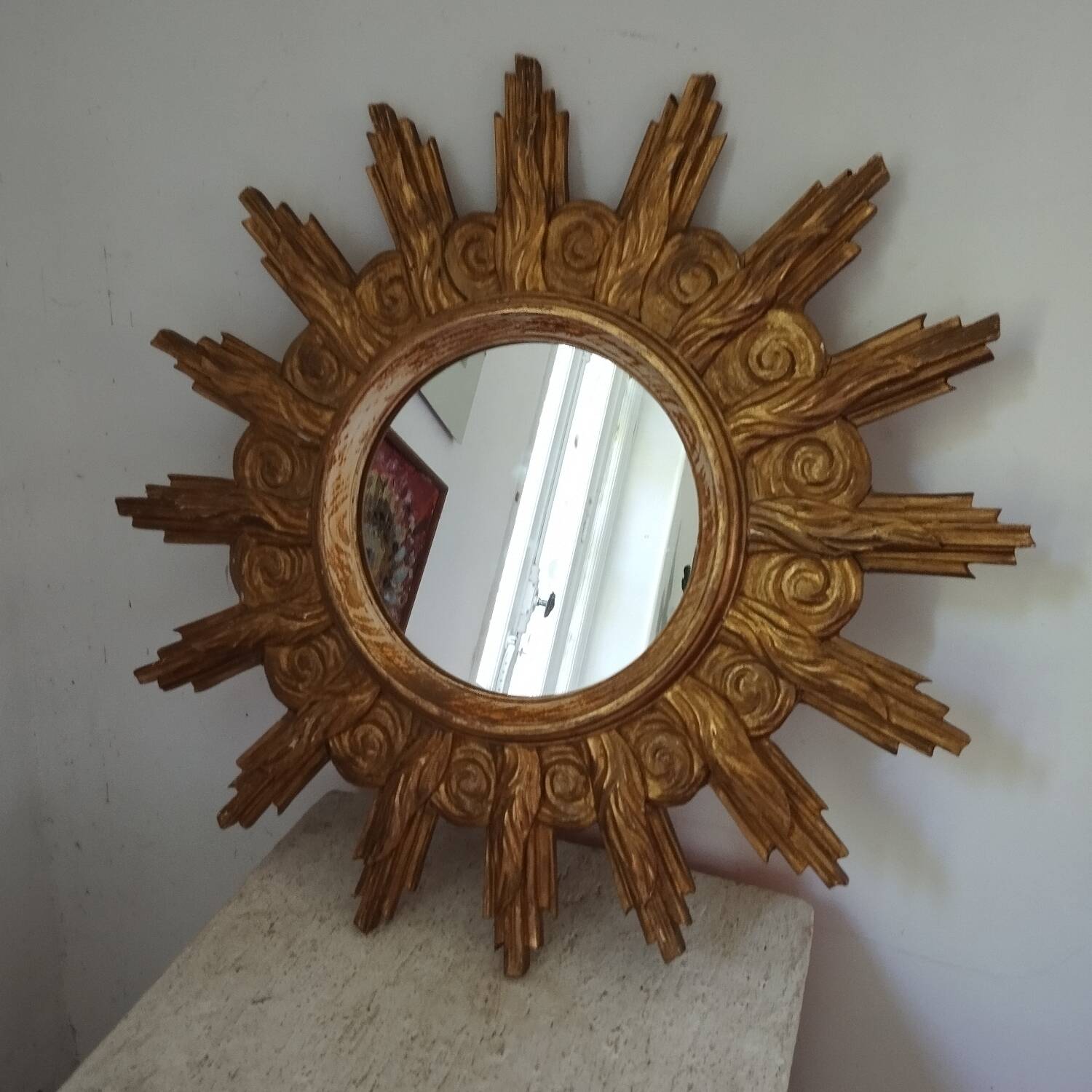 Miroir soleil bois sculpté doré