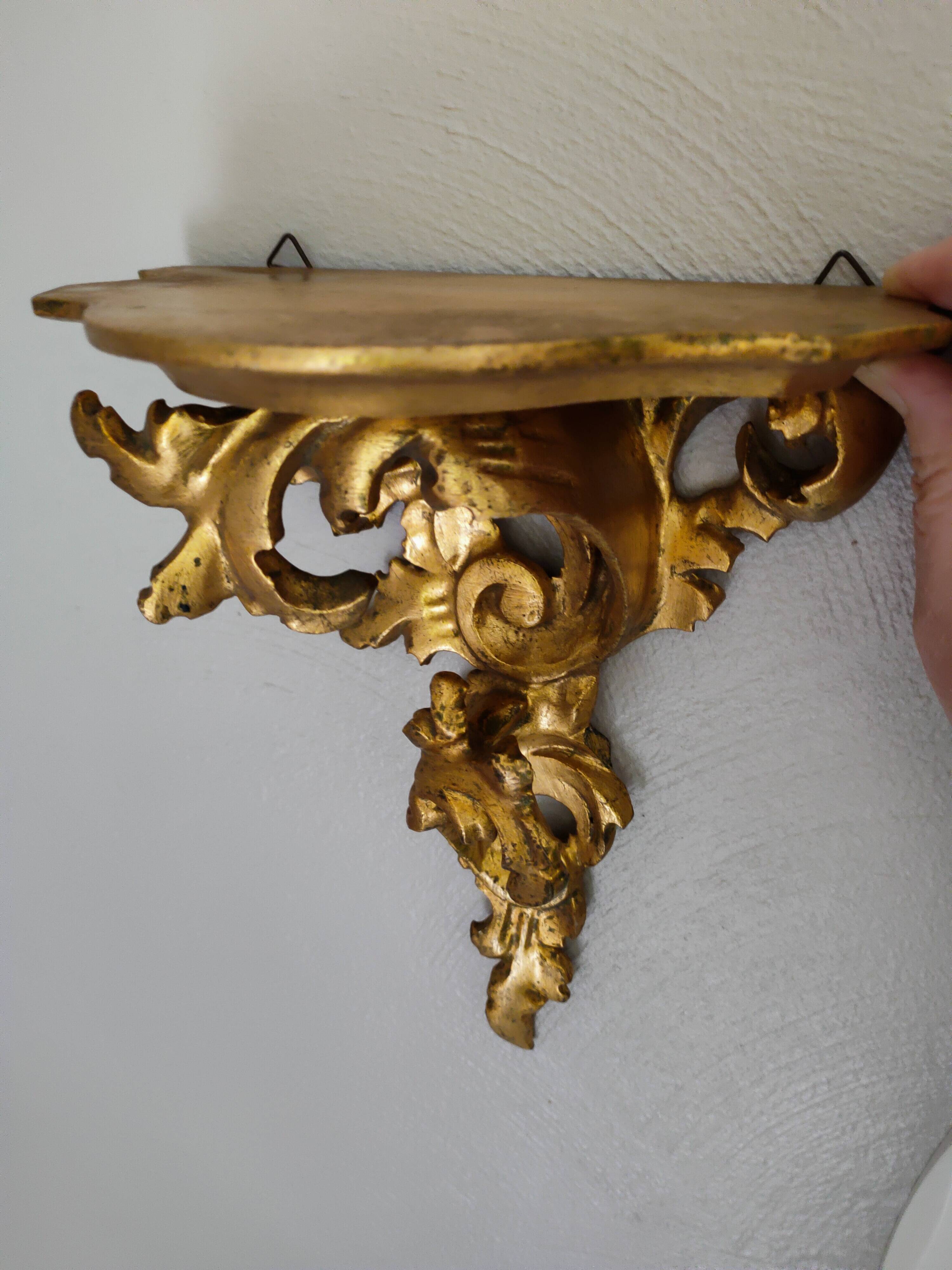 Baroque style golden shelf.