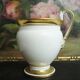 Tasse et soucoupe ancienne en porcelaine blanche et or XIXème avec poignée forme tête de cygne