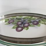 Vintage earthenware tray surrounded by antique metal