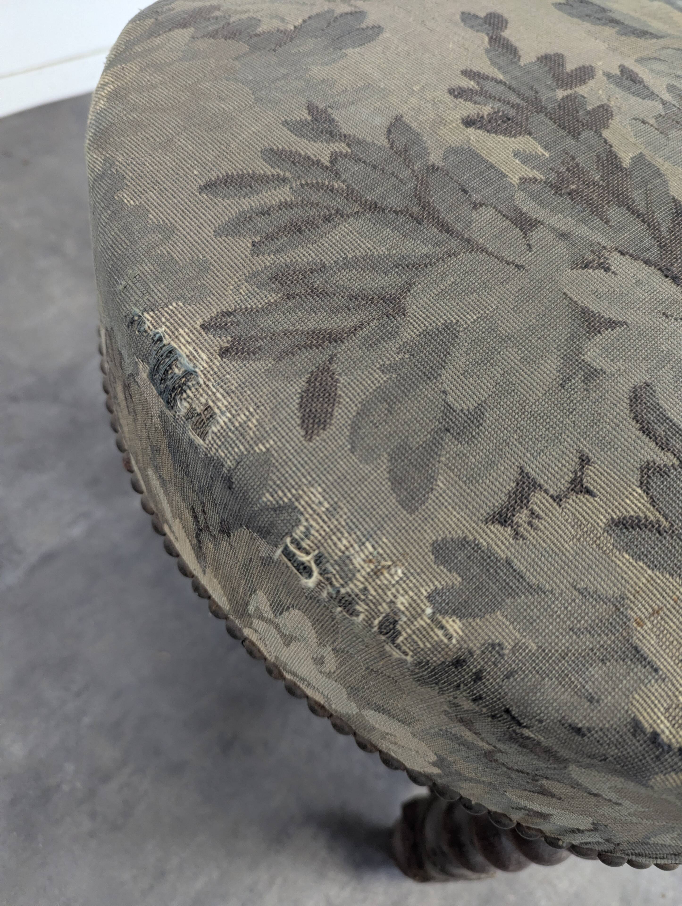 Napoleon III smoking chair in twisted blackened wood with foliage upholstery.