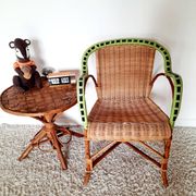 1950s 60s rattan armchair with green apple and black piping.