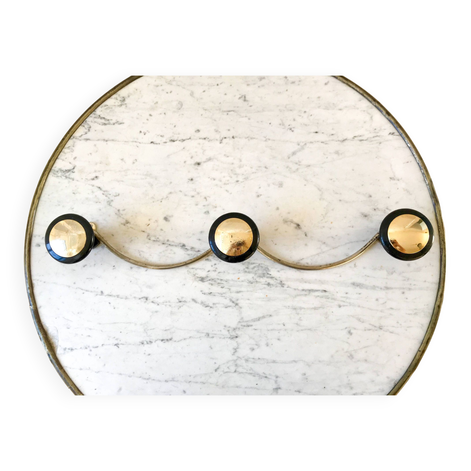 silver and black metal coat hook from the 70s