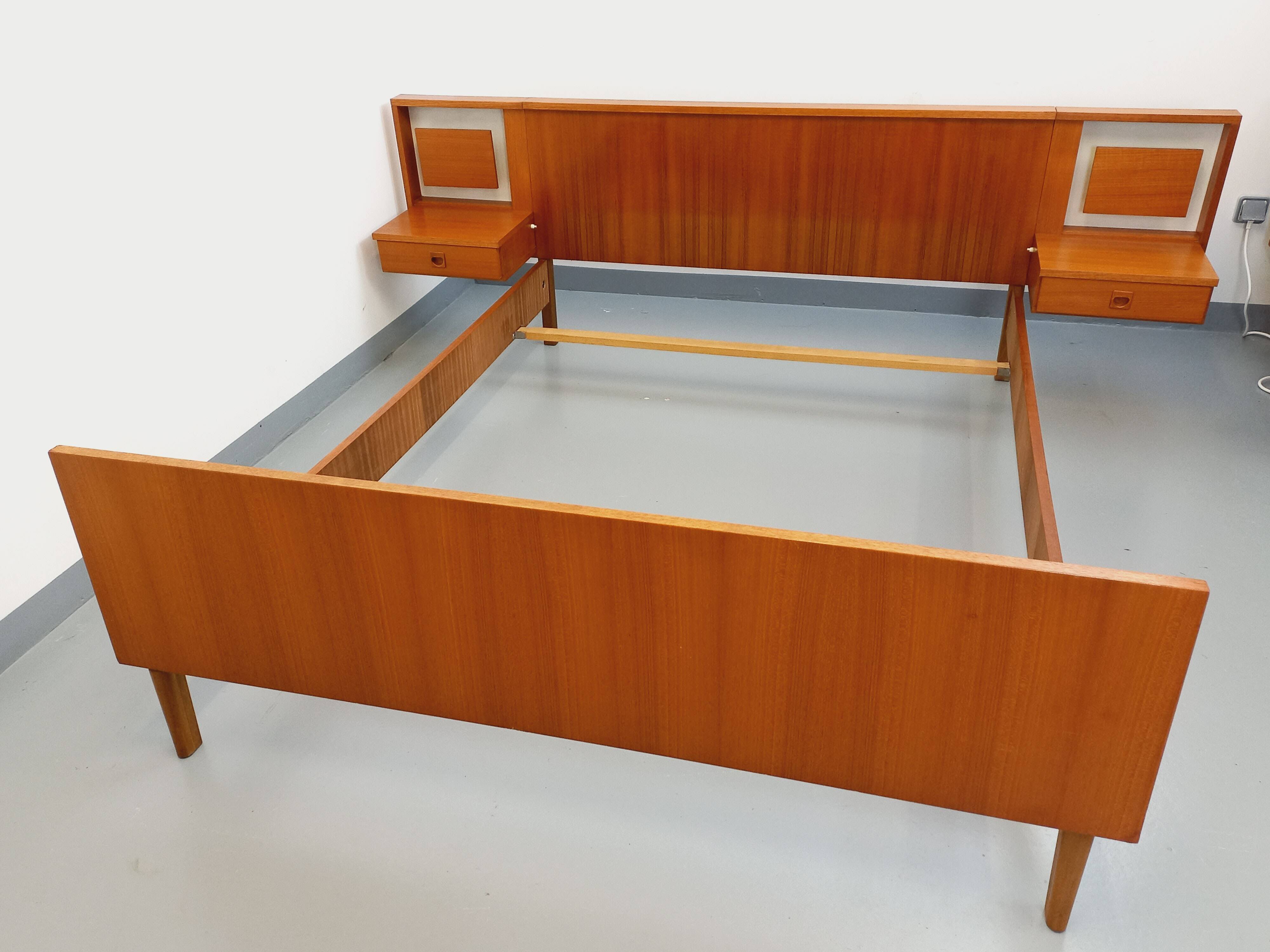 Vintage Scandinavian style double bed in teak from the 60s with integrated bedside lights