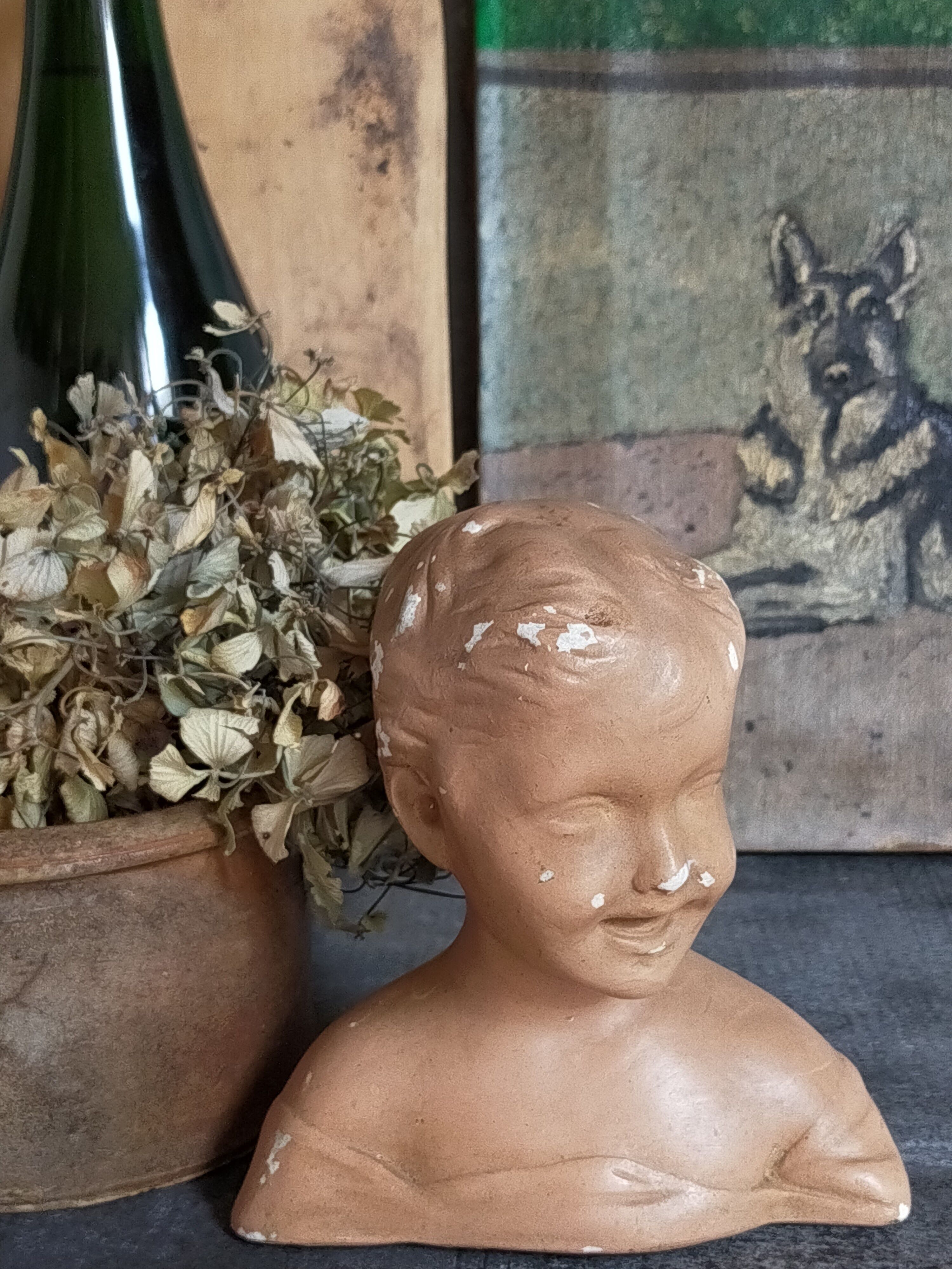 Bust of a small child in ancient plaster