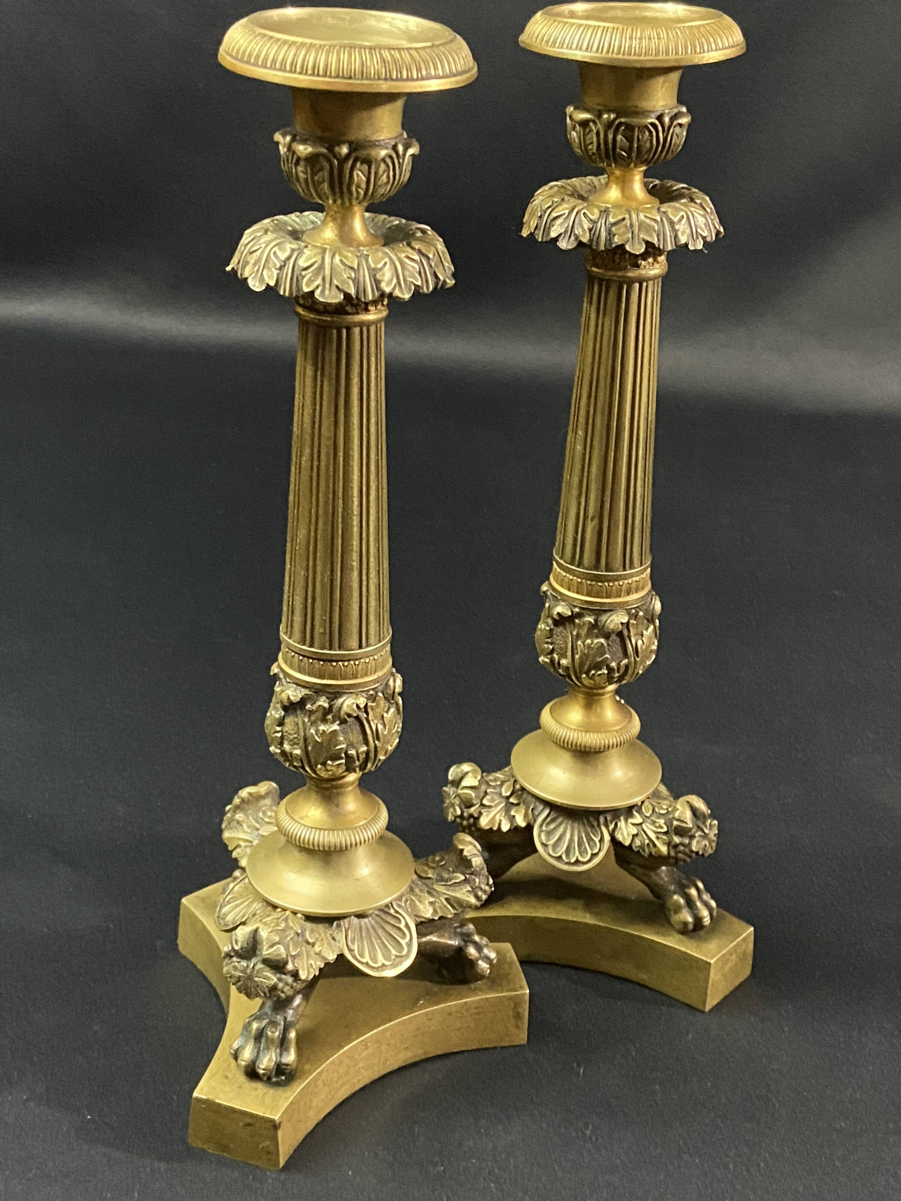 Pair of gilt and chiseled bronze candlesticks from the Restoration period