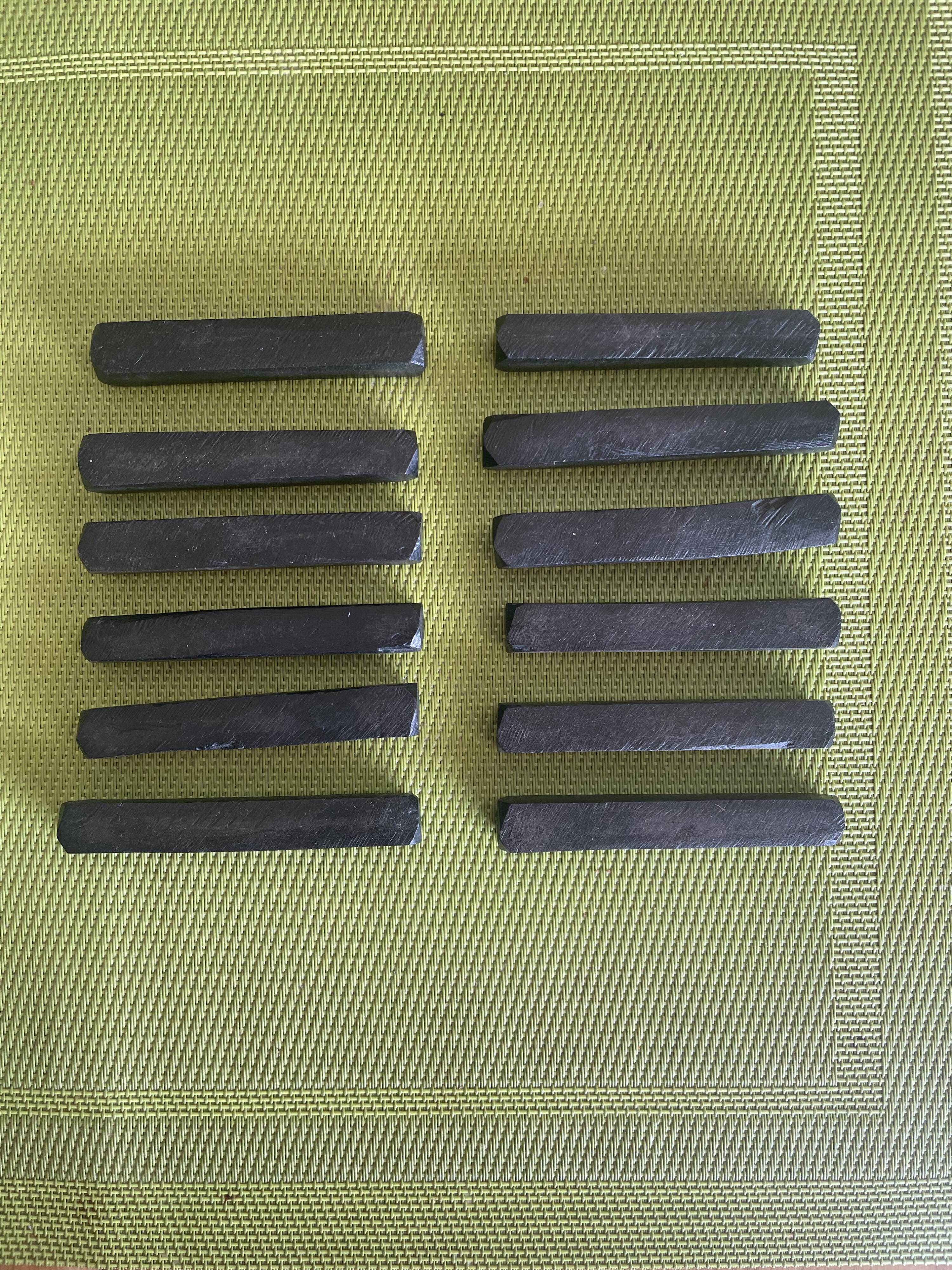 Set of 12 vintage ebony knife rests