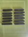 Set of 12 vintage ebony knife rests