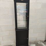 Old wooden window of black patina store two doors