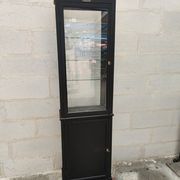 Old wooden window of black patina store two doors