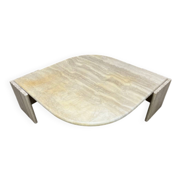 Travertine coffee table in eye shape by Roche Bobois.