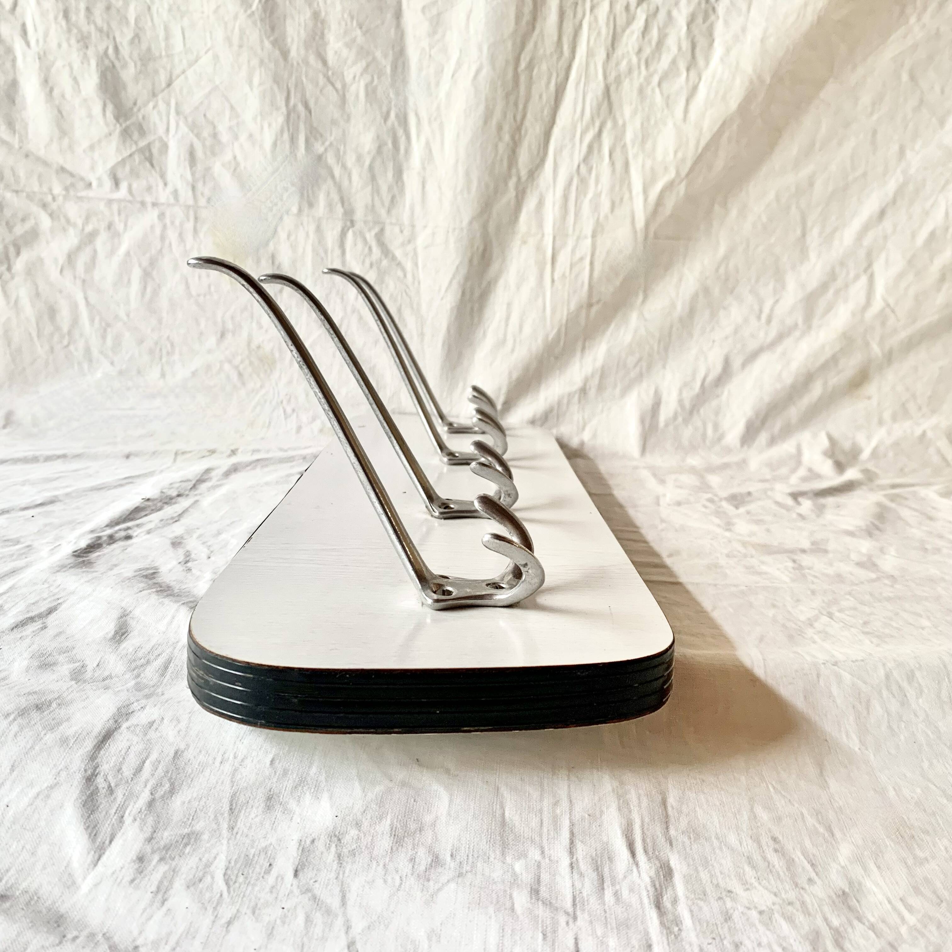 Vintage wall coat rack in white Formica - 4 cast aluminum coat hooks