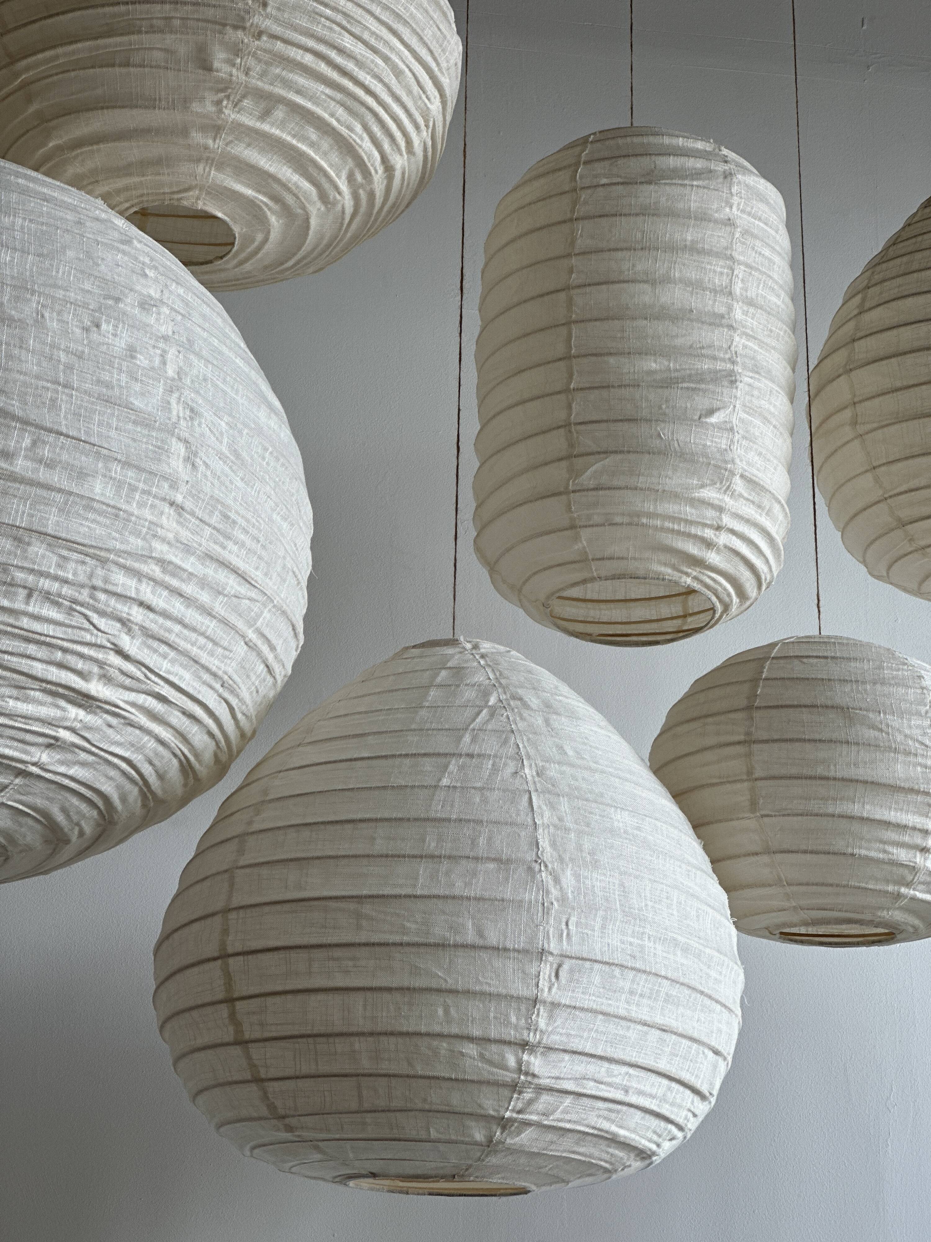 Suspension in rattan and natural japanese linen in the shape of a drop