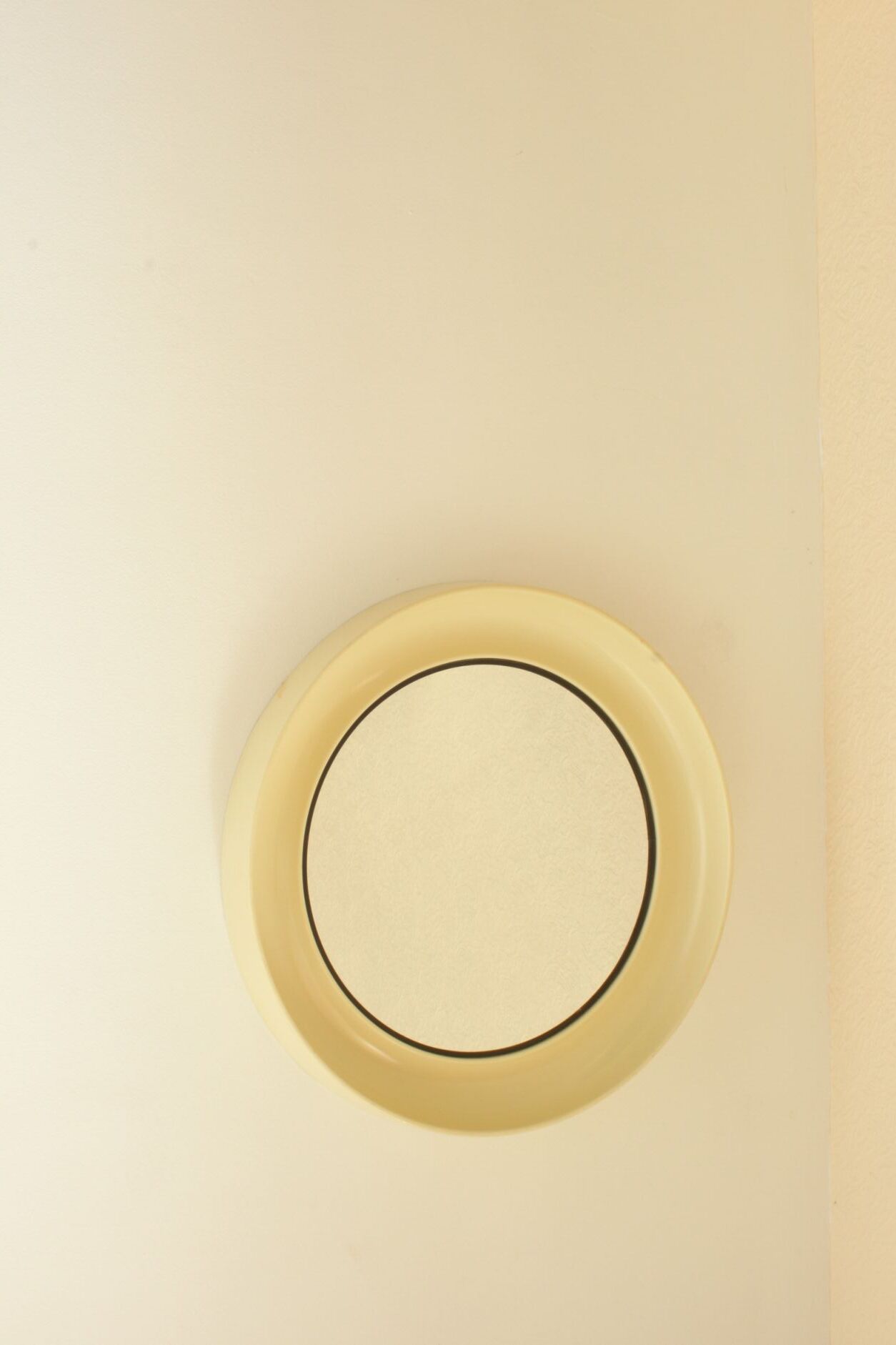 Round conical mirror in white plastic, Denmark 1960s.