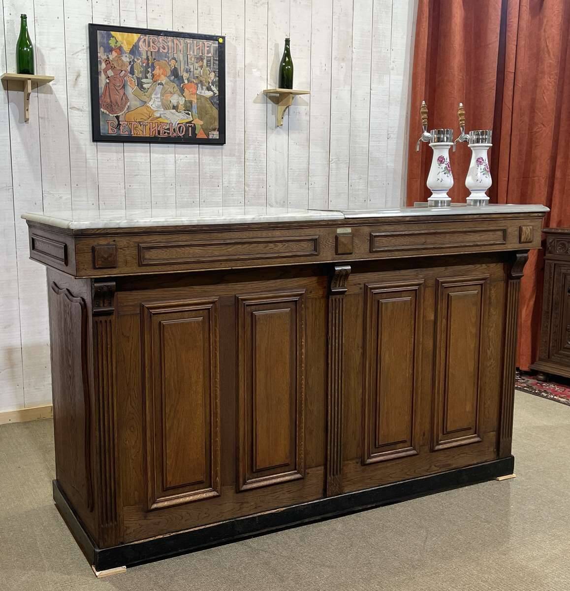 Bar counter in oak, zinc, and white marble from the early 20th century.