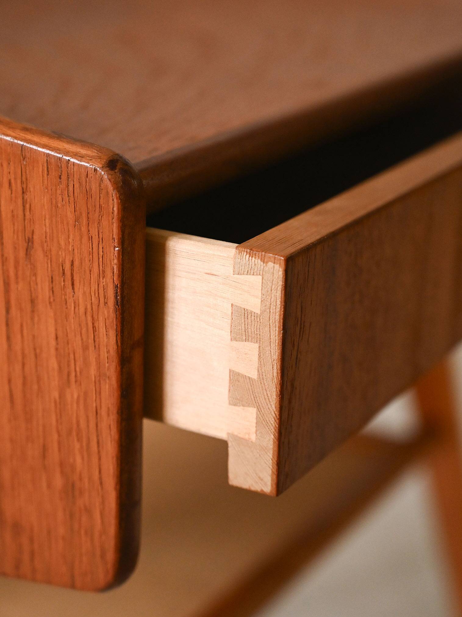 Bedside table with rattan magazine rack