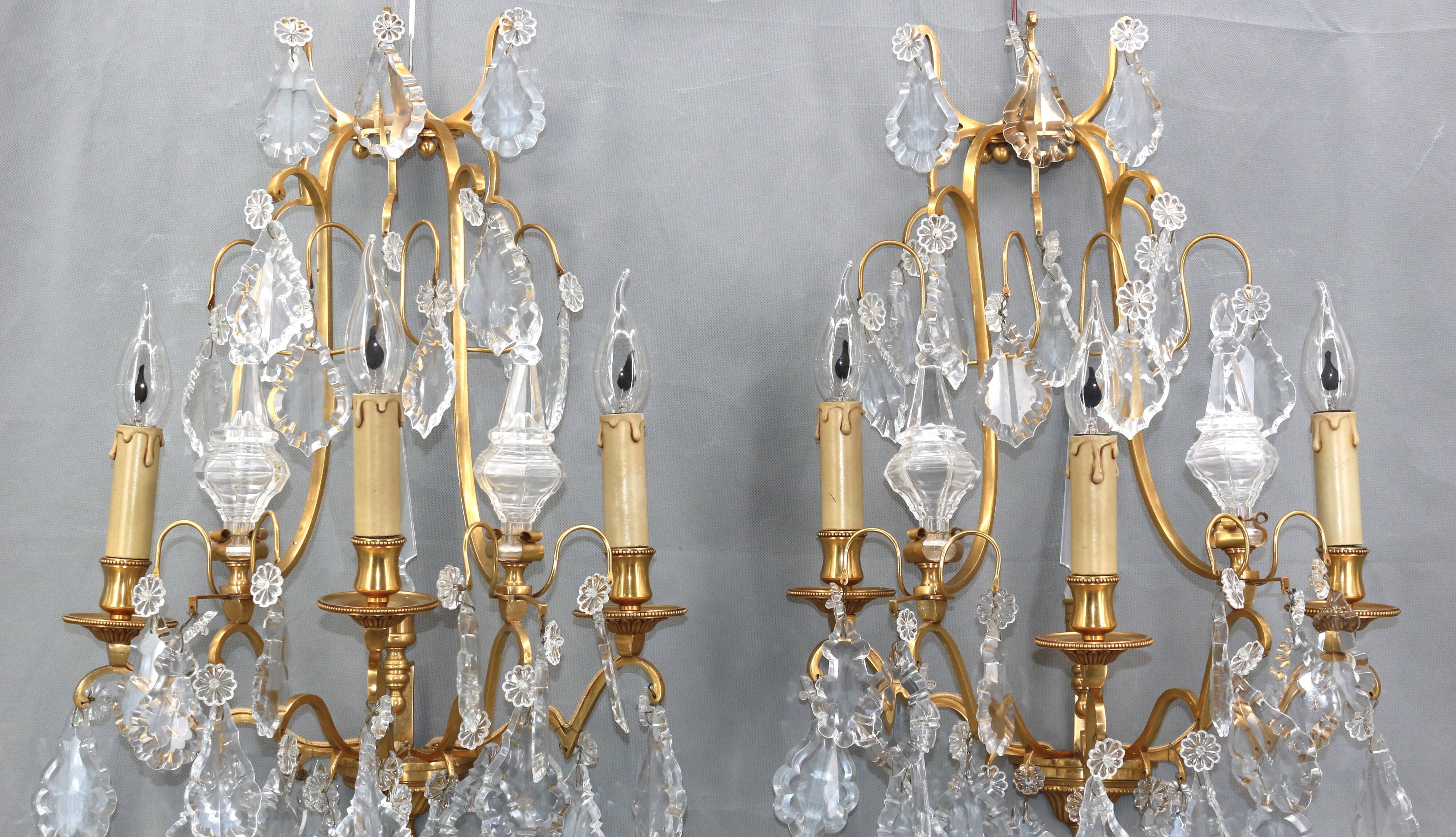 Pair of Louis XVI style gilded bronze & bohemian crystal sconces