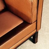 Armchair design Scandinavian brown leather.