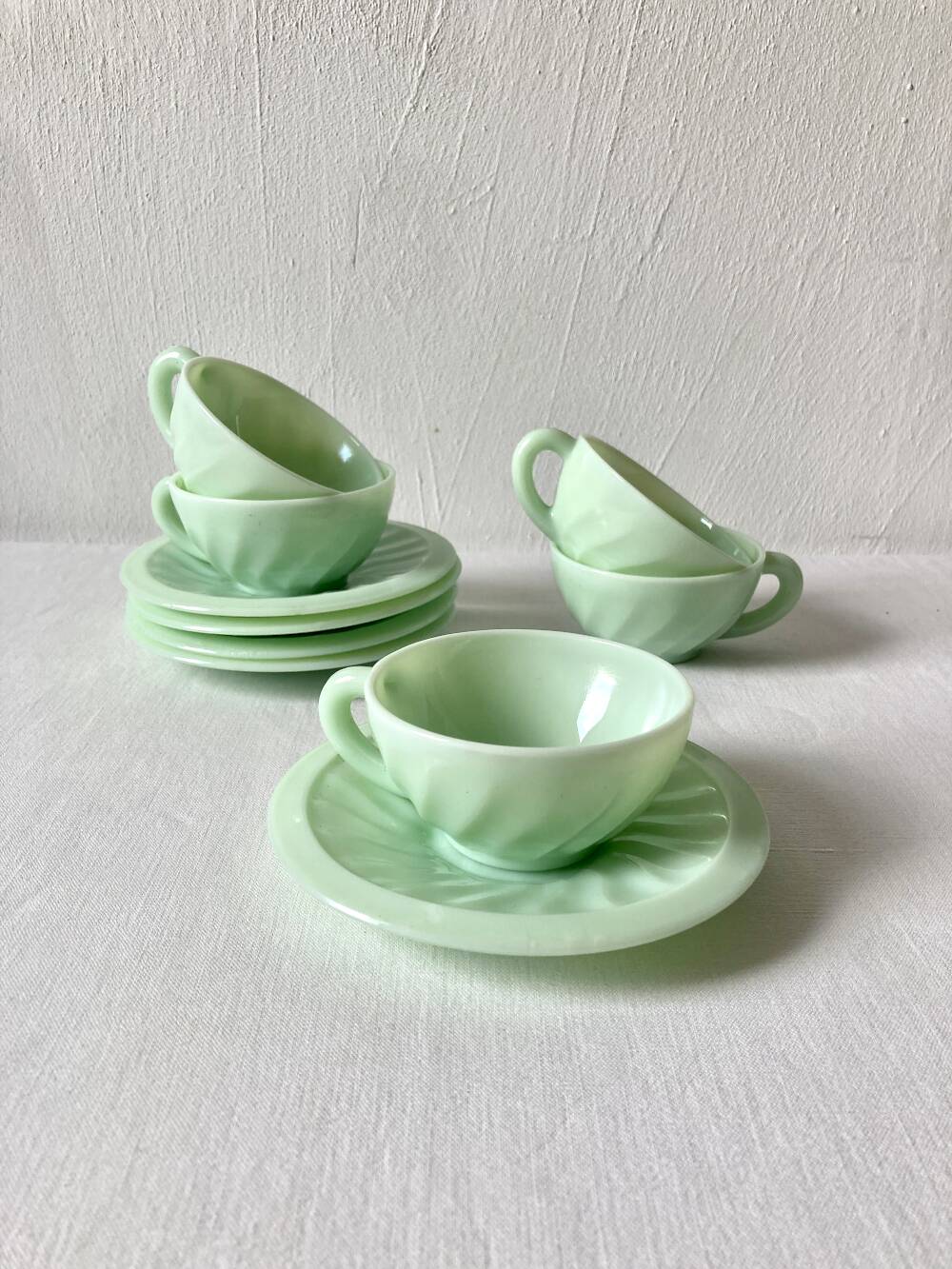 Pressed glass cups and saucers, 1950s