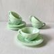 Pressed glass cups and saucers, 1950s