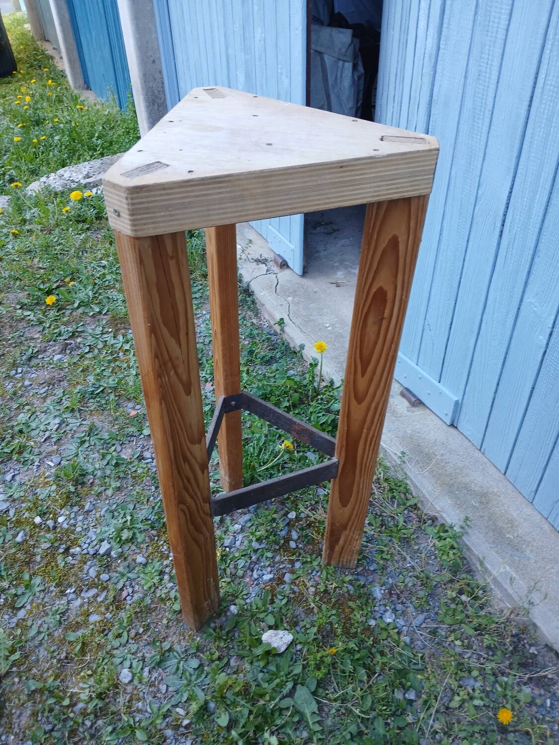 Antique saddle in raw wood and metal