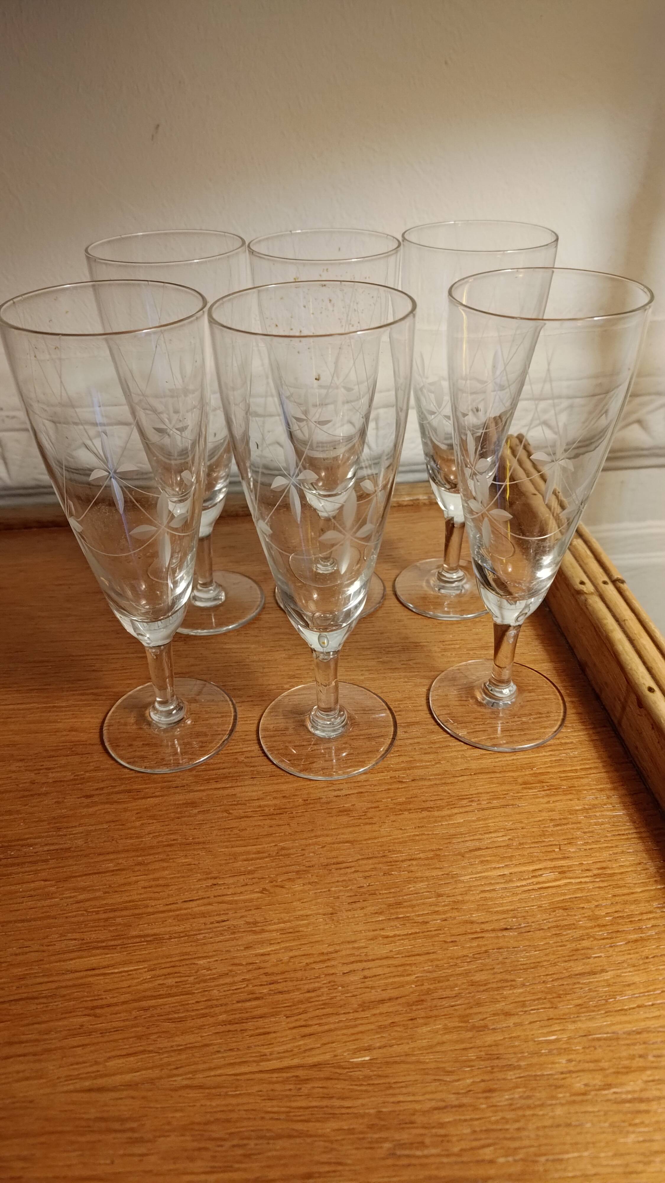 Six engraved crystal champagne flutes