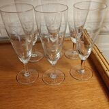 Six engraved crystal champagne flutes