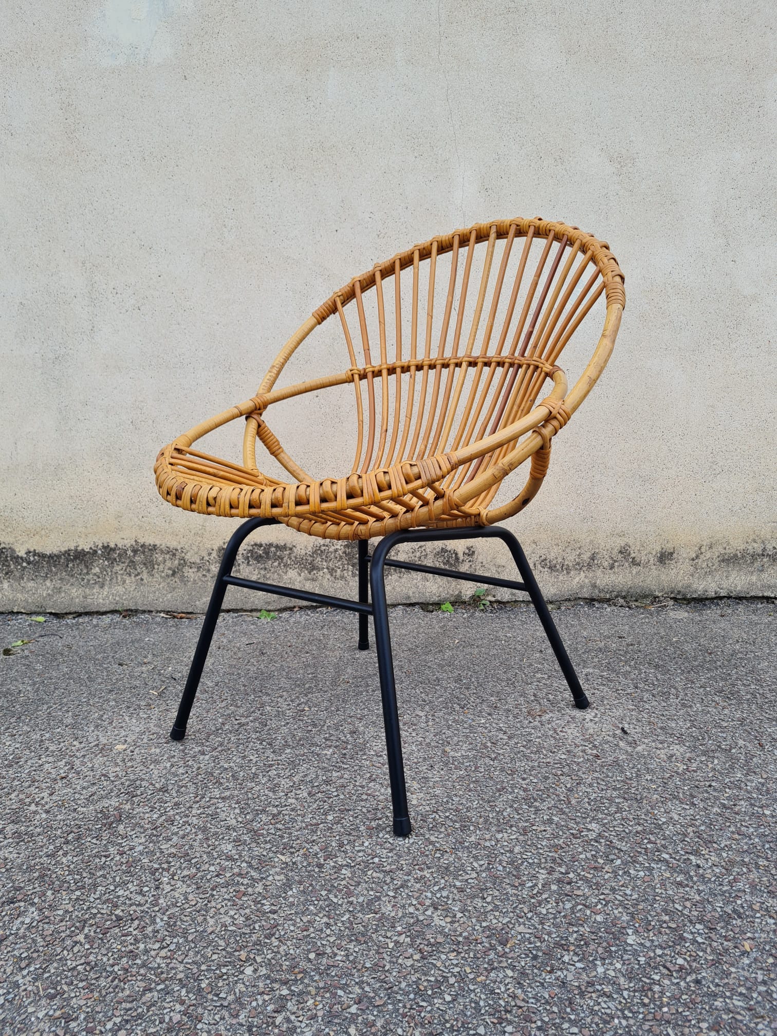 Vintage rattan shell armchair from the 60s