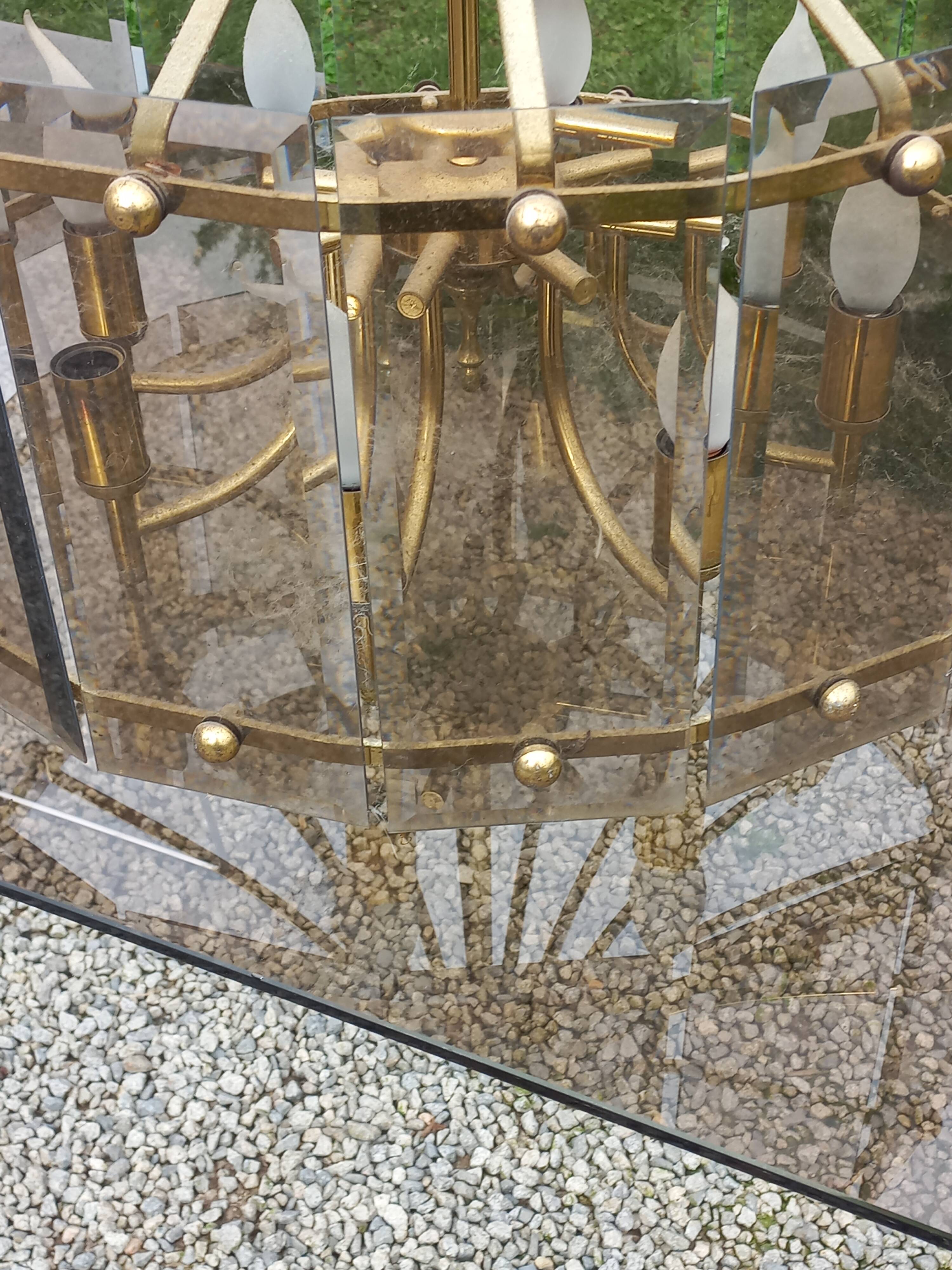 70s designer chandelier with smoked glass plates and gold metal frame