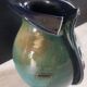 Vase artisanal, esprit costume h 26 cm, signé