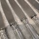 12 silver-plated metal table knives with rocaille ribbon decoration, 25.1 cm