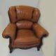 Louis XV style tawny leather chair