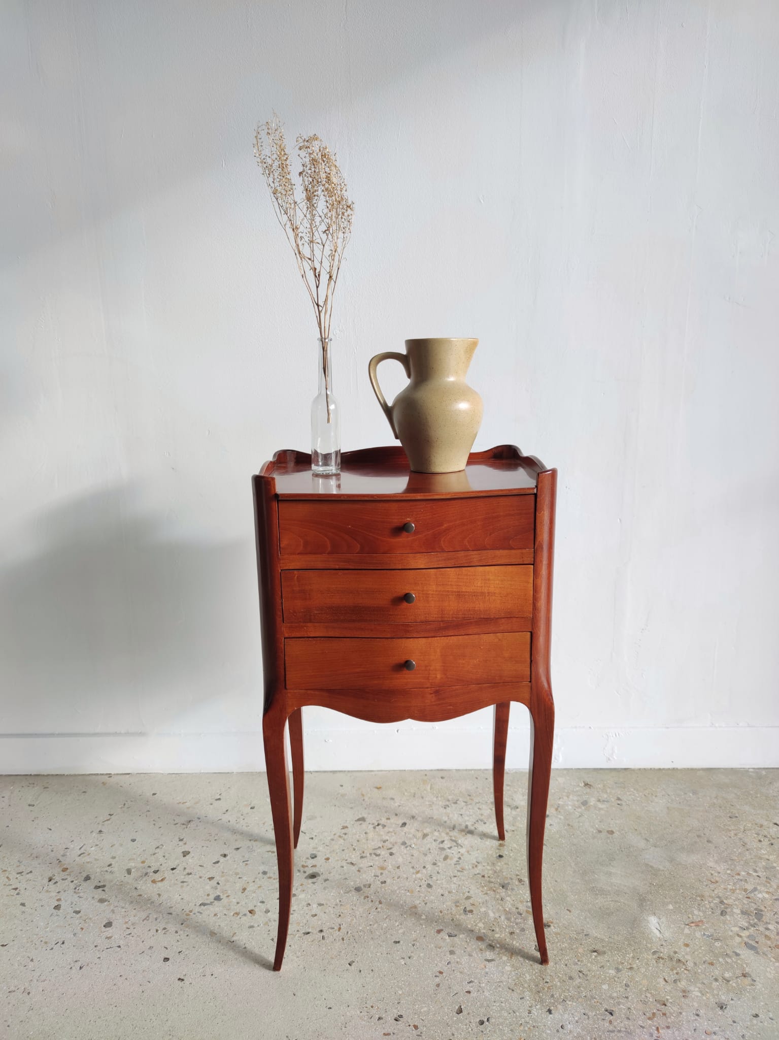 Three-drawer cherry bedside table